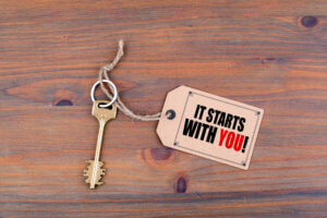 Decorative image of key with the phrase, It starts with YOU!